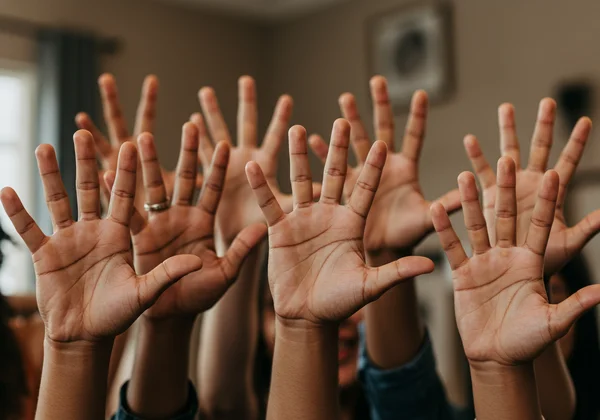 Hands showing ten fingers up for Never Have I Ever.